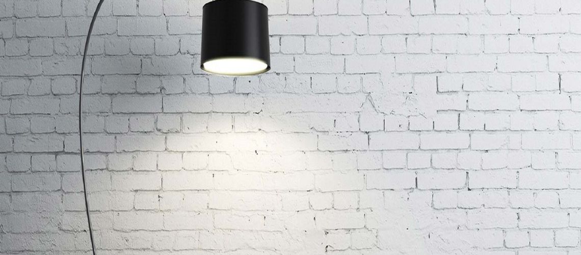 Lamp on next to brick wall