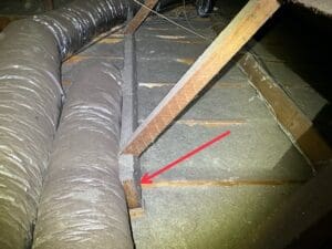 Structural defect in a roof frame found during a roof inspection