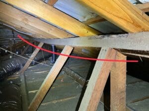 Structural defect in a roof frame found during a roof inspection