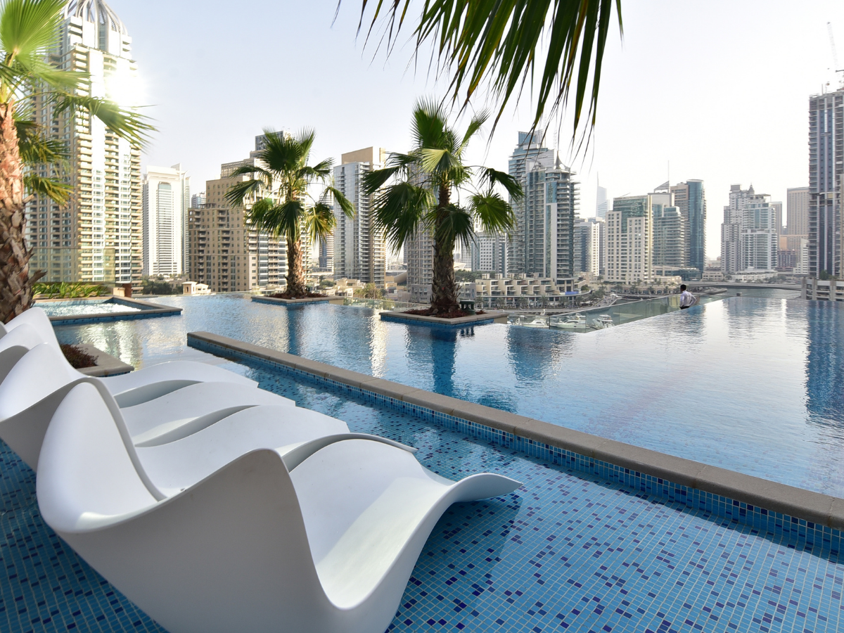 Pool area with view of city buildings during apartment building inspection